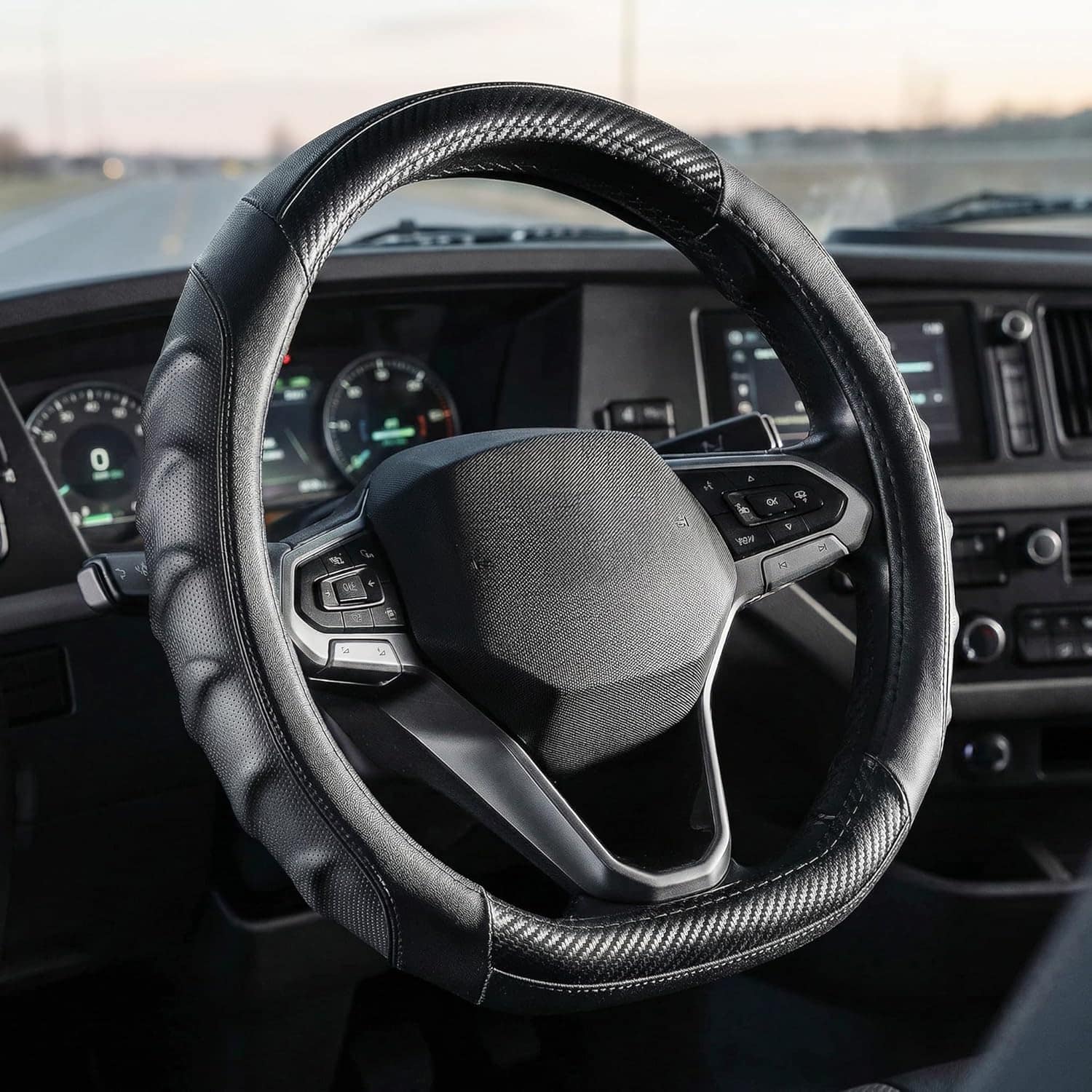Vyonix 15 inch carbon fiber D-shape steering wheel cover installed on a car dashboard
