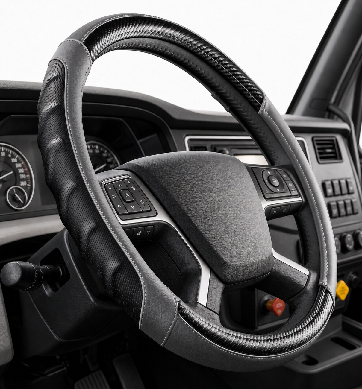 Vyonix 18 inch semi truck steering wheel cover in Grey with black carbon fibre accents, fitted in a truck cab