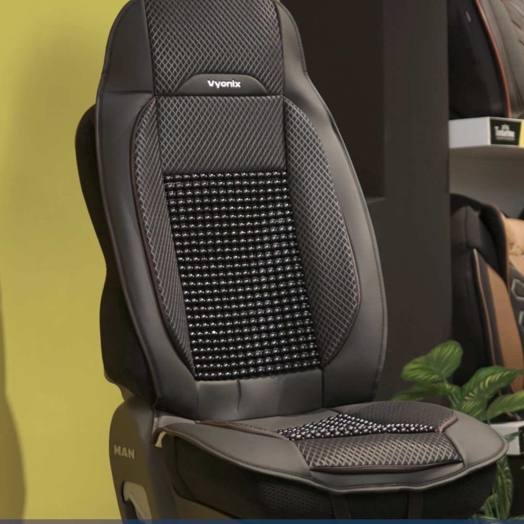 Vyonix beaded seat cover fitted on a semi truck driver seat