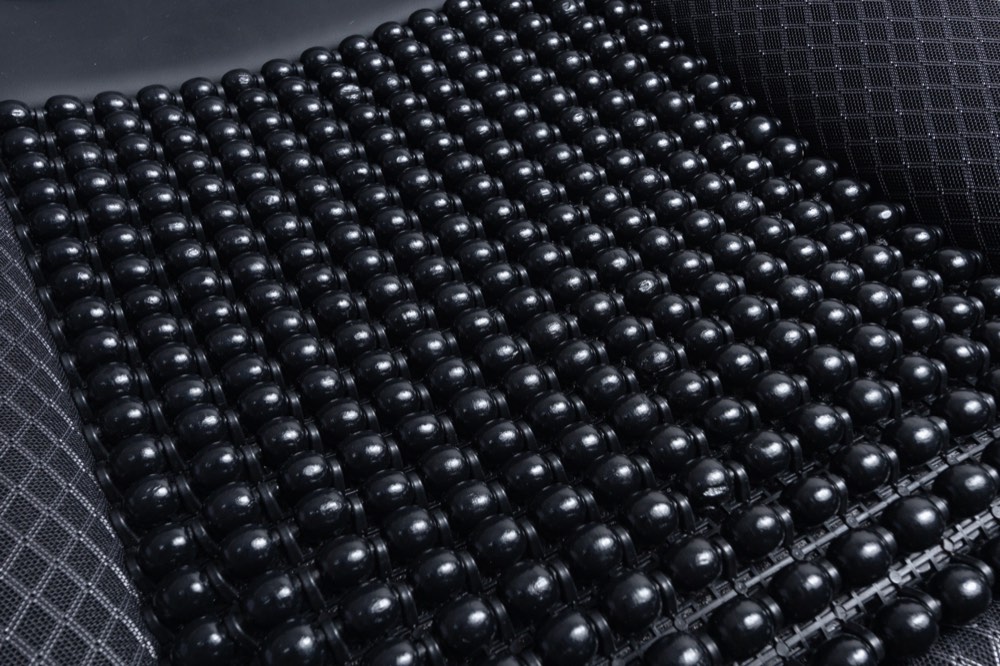 Close-up of wooden beads on a Vyonix beaded seat cover